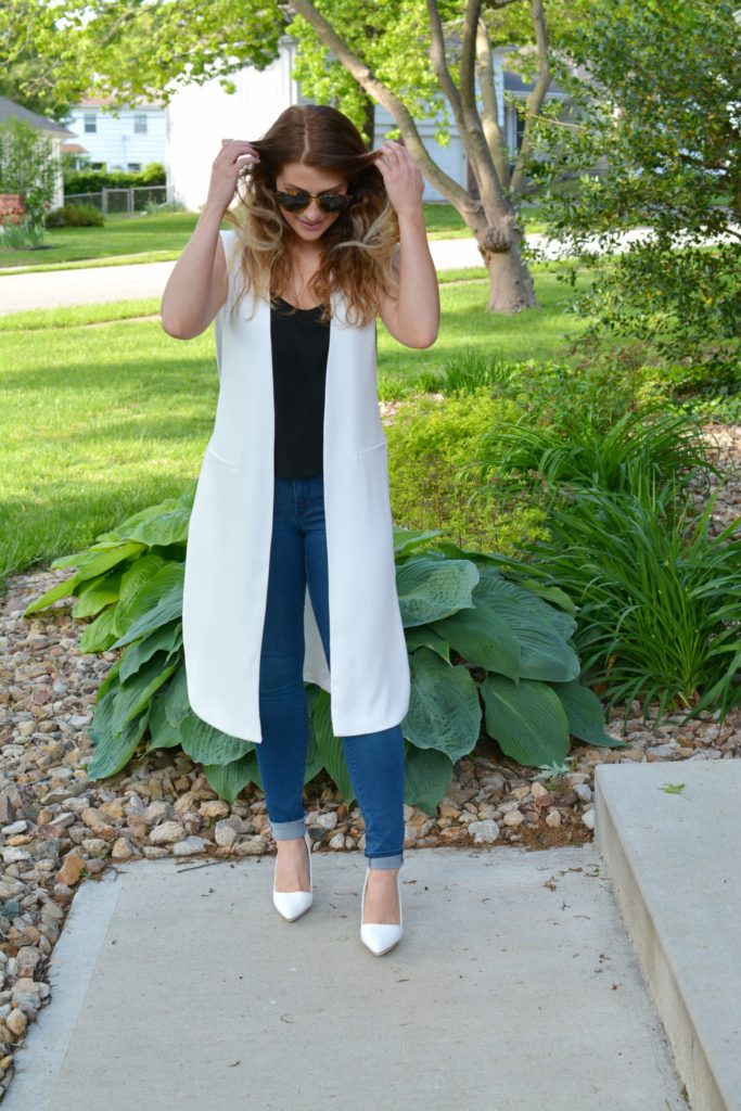 Ashley from LSR in a long white vest and white pumps