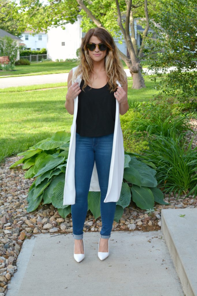 Ashley from LSR in a long white vest and white pumps