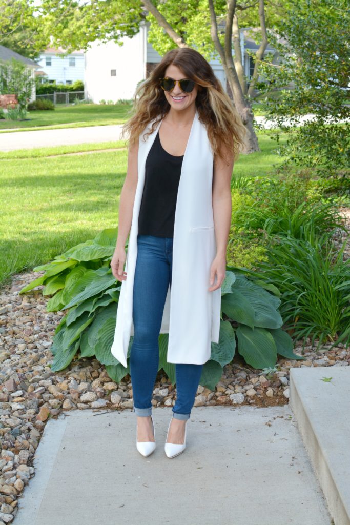 Ashley from LSR in a long white vest and white pumps