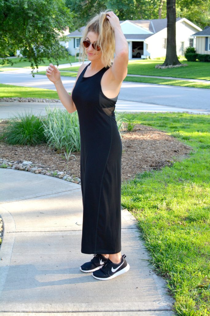 Ashley from LSR in a black ALALA dress and Nike sneakers