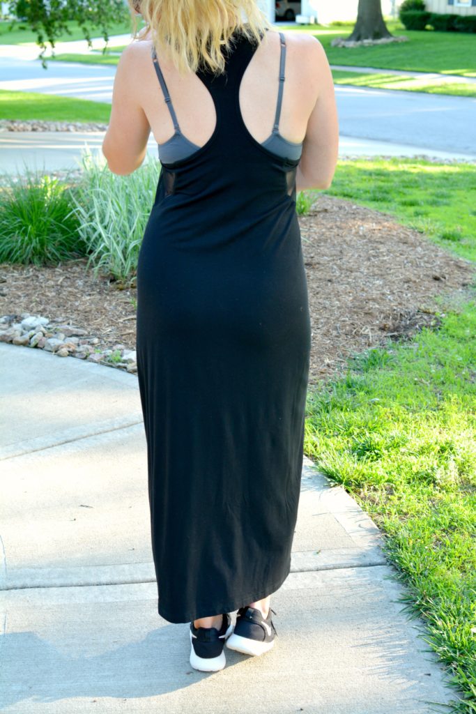 Ashley from LSR in a black ALALA dress and Nike sneakers