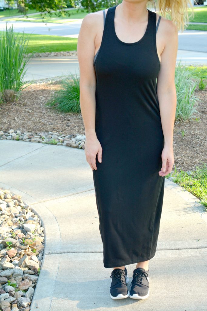 Ashley from LSR in a black ALALA dress and Nike sneakers