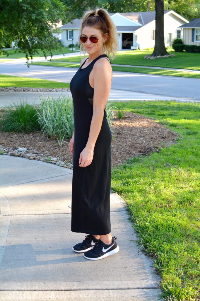 Ashley from LSR in a black ALALA dress and Nike sneakers