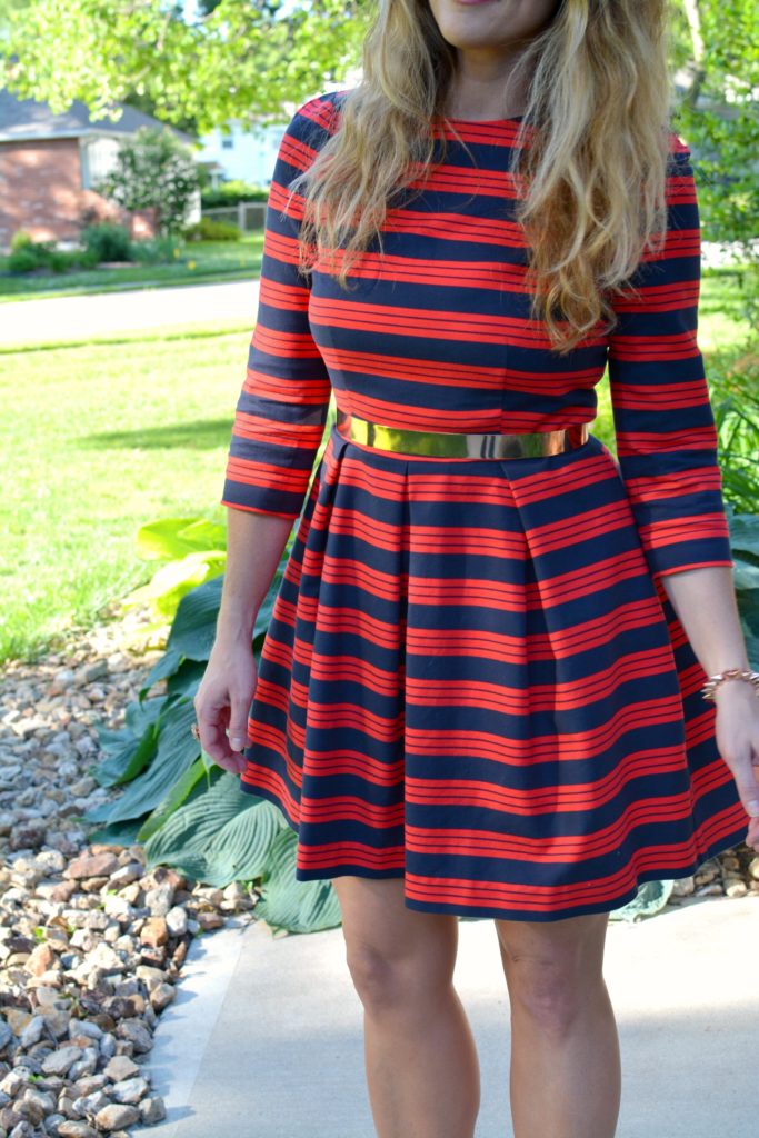 Ashley from LSR wearing a red and blue striped dress and metal belt