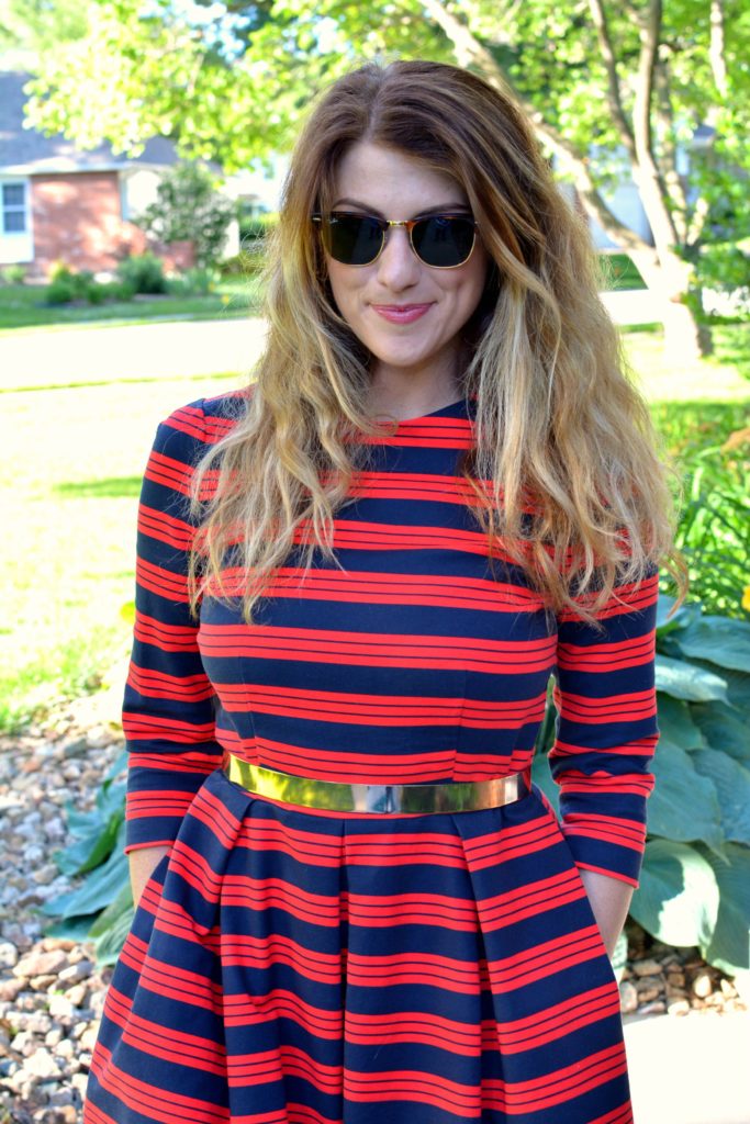 Ashley from LSR wearing a red and blue striped dress and metal belt