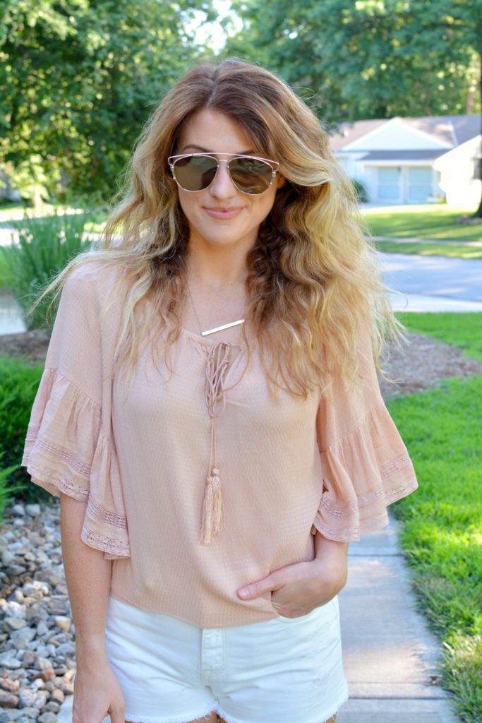 Ashley from LSR in a blush top from Zara and white denim shorts