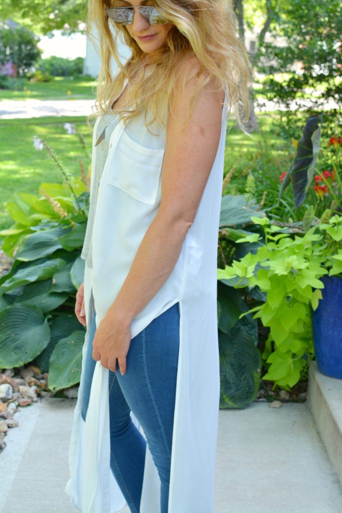 Ashley from LSR in a white duster and stepped hem jeans