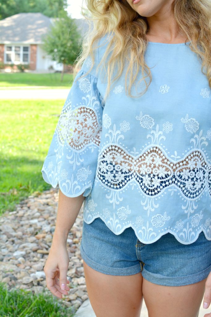 Ashley from LSR in a chambray and lace blouse and denim shorts