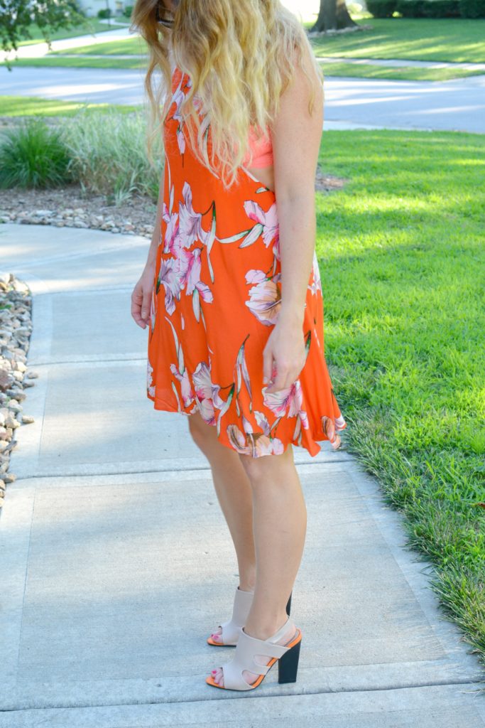 Ashley from LSR in an orange Minkpink dress and mule sandals