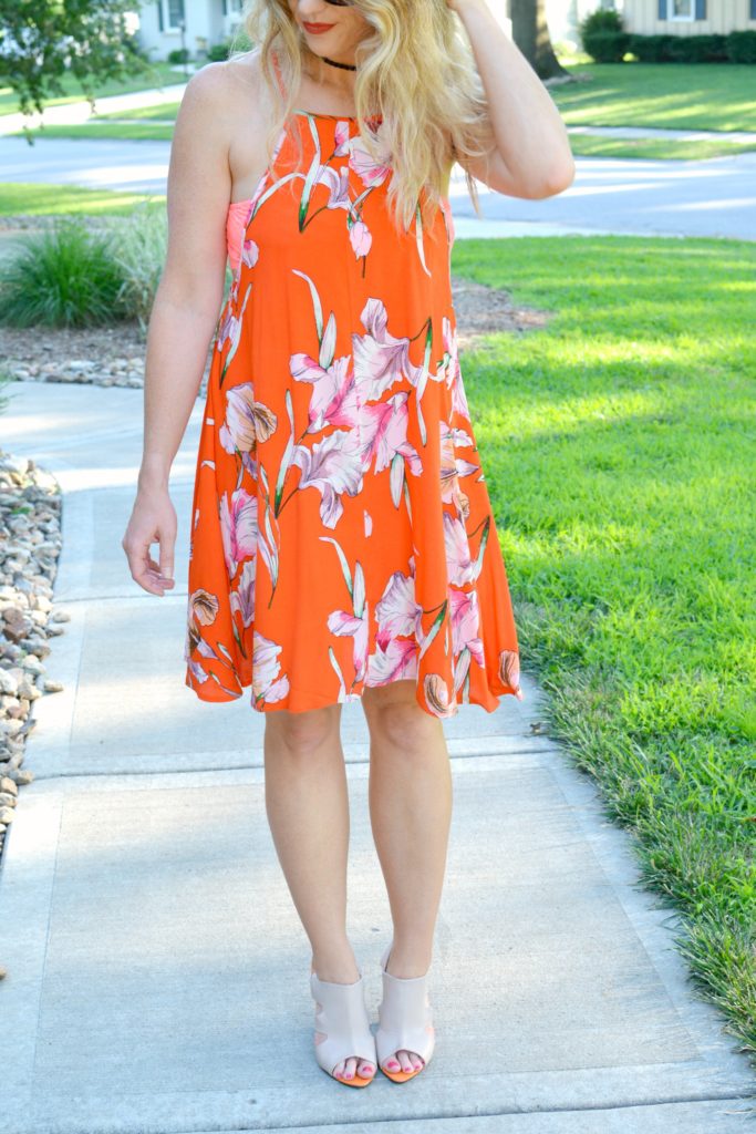 Ashley from LSR in an orange Minkpink dress and mule sandals