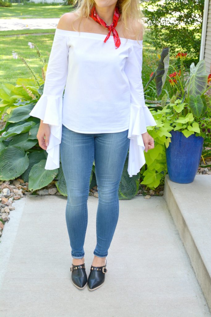 Ashley from LSR in a white off-the-shoulder statement blouse and The Limited denim, with leather mules