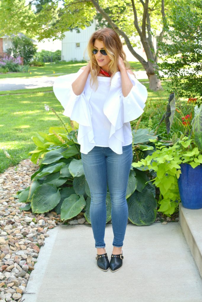 Ashley from LSR in a white off-the-shoulder statement blouse and The Limited denim, with leather mules