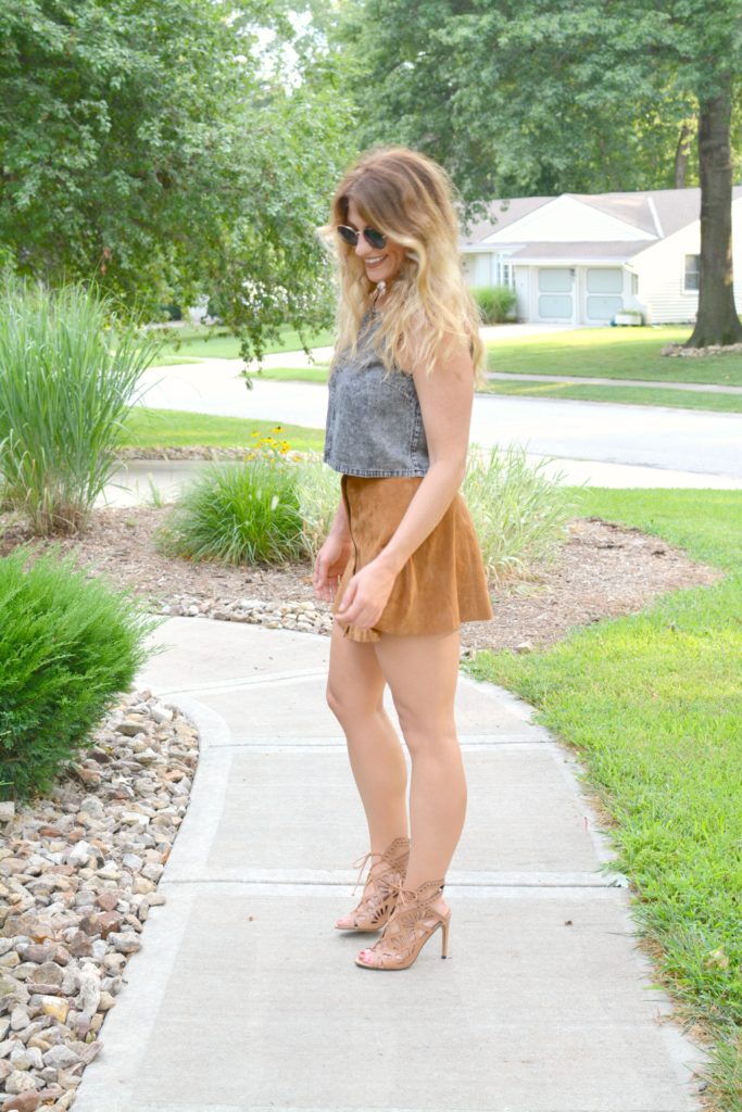 Ashley from LSR in an acid wash crop top and faux suede skirt