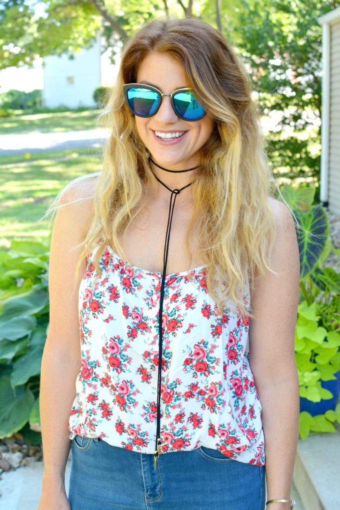 Ashley from LSR in a floral tank, Diff sunglasses, and a Vanessa Mooney choker