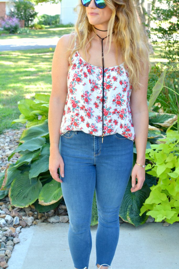 Ashley from LSR in a floral tank, Diff sunglasses, and a Vanessa Mooney choker