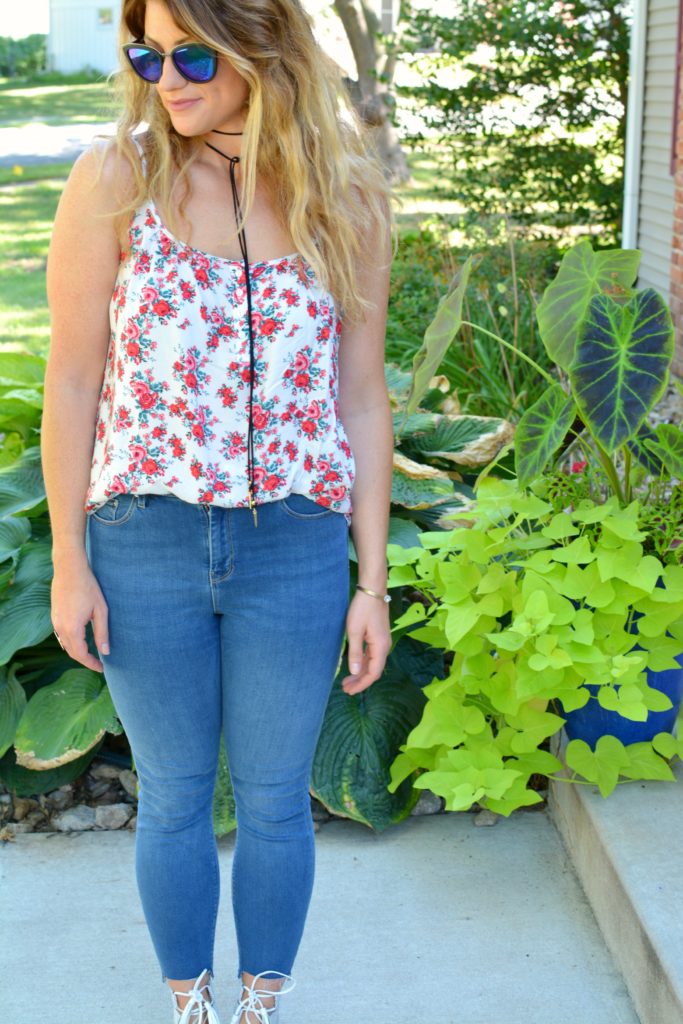 Ashley from LSR in a floral tank, Diff sunglasses, and a Vanessa Mooney choker