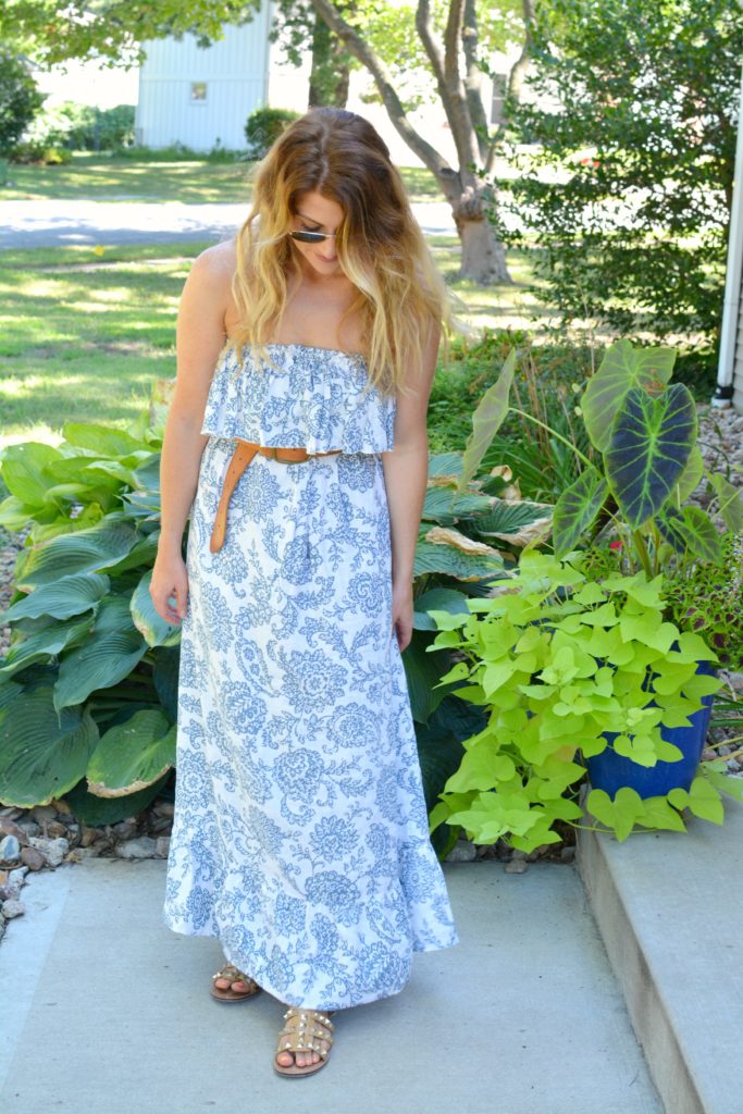 Ashley from LSR in a printed linen maxi dress, linea pelle belt, and studded sandals
