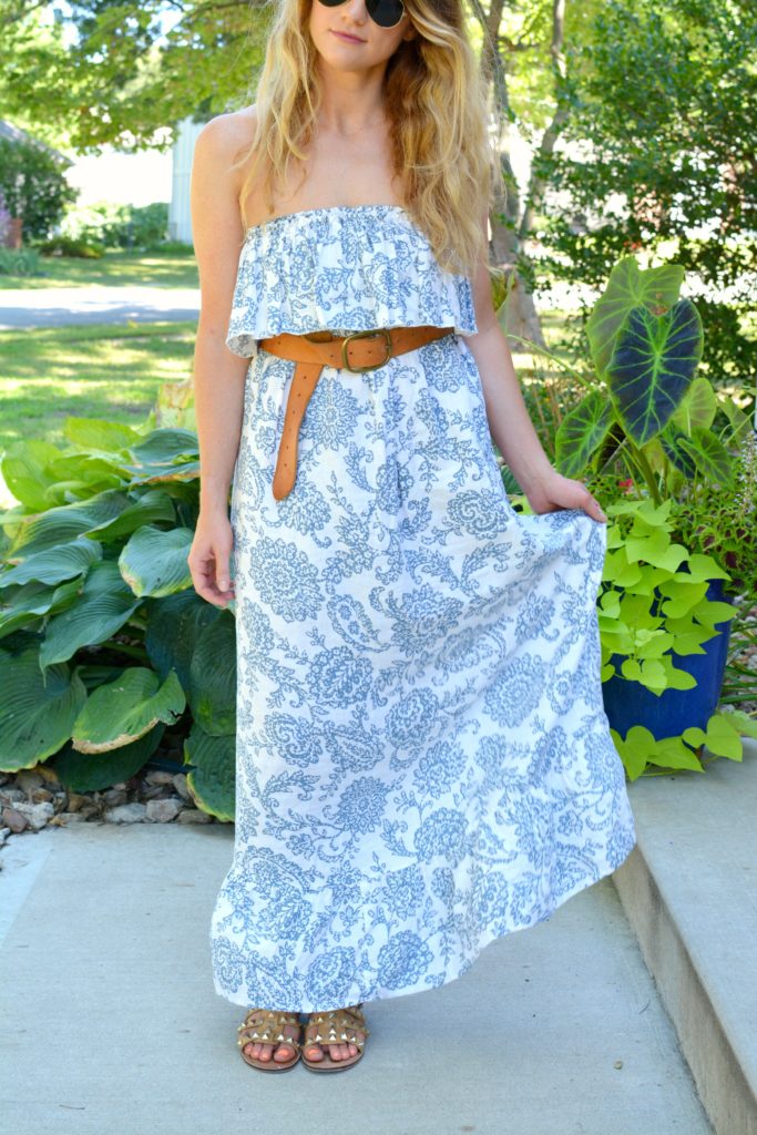 Ashley from LSR in a printed linen maxi dress, linea pelle belt, and studded sandals