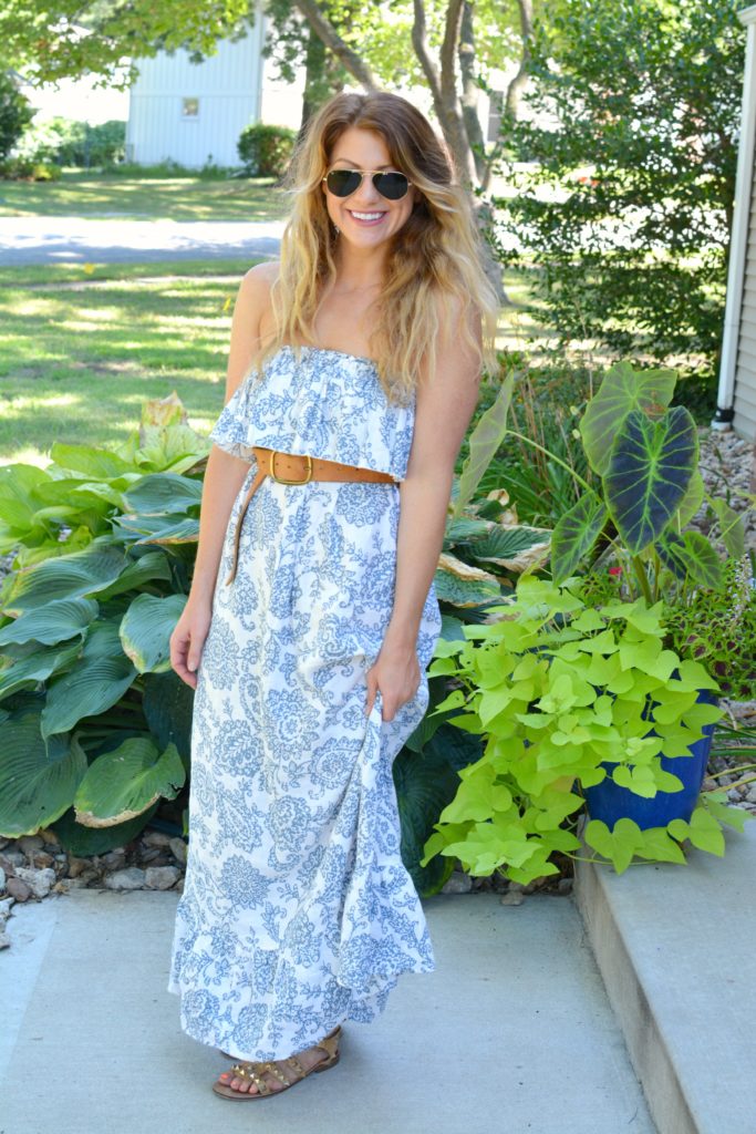 Ashley from LSR in a printed linen maxi dress, linea pelle belt, and studded sandals