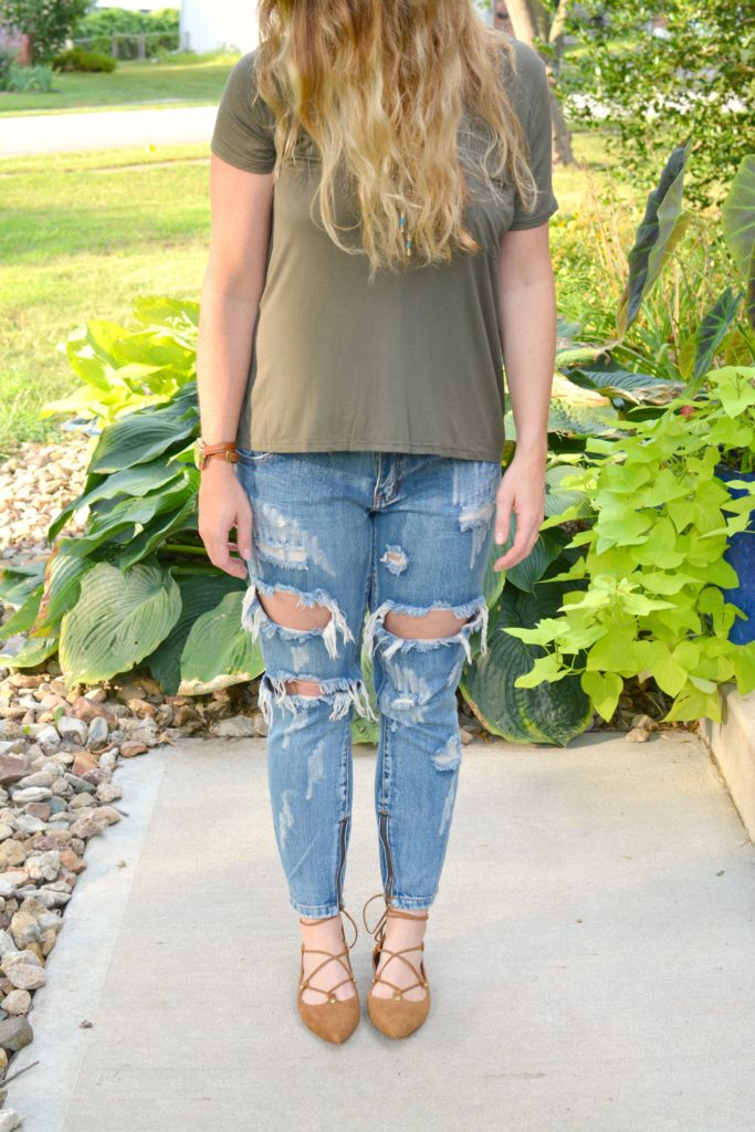 Ashley from LSR in an olive green tee and One Teaspoon jeans