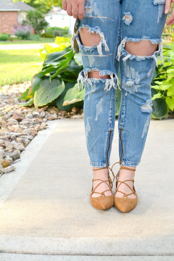 Ashley from LSR in an olive green tee and lace-up ballet flats