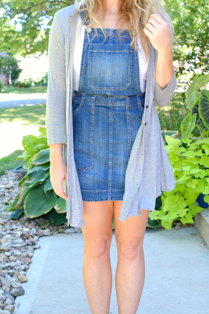 Ashley from LSR in an overall dress and gray cardigan