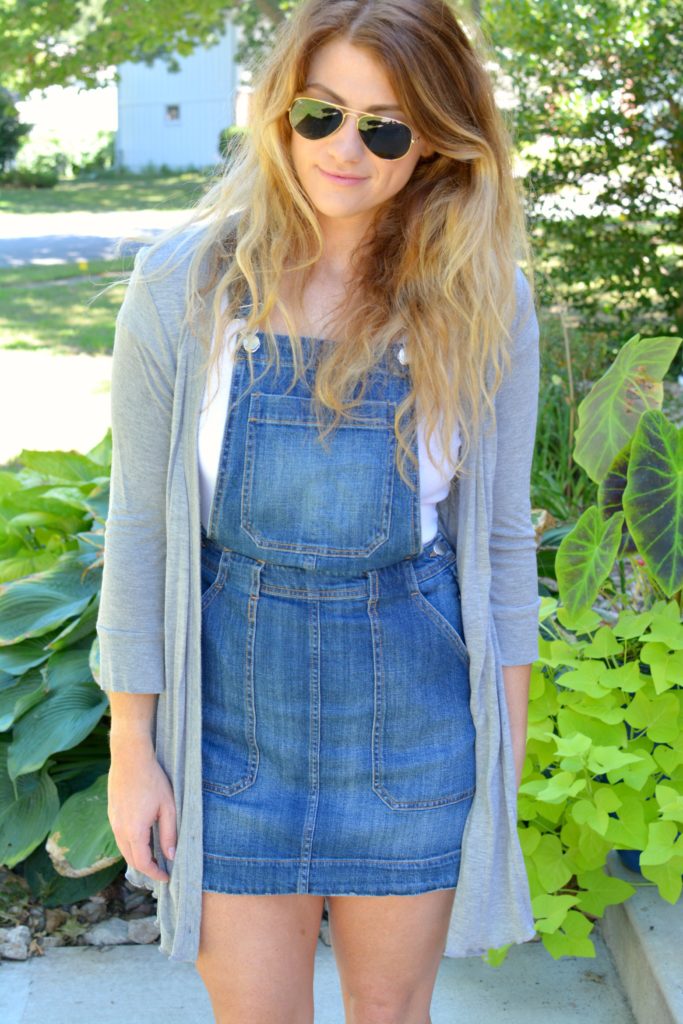 Ashley from LSR in an overall dress and gray cardigan