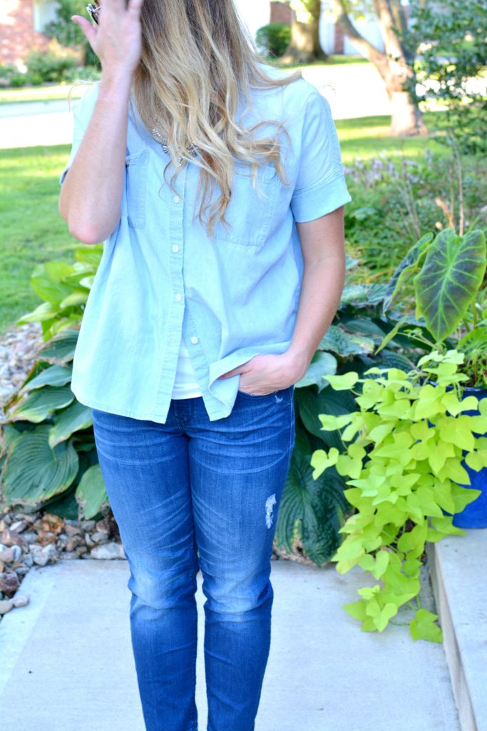 Ashley from LSR in a light chambray shirt and raw hem jeans