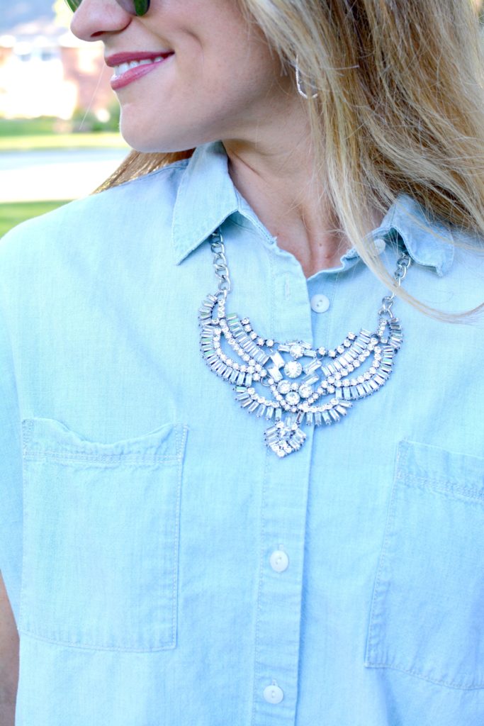 Ashley from LSR in a light chambray shirt and a statement necklace