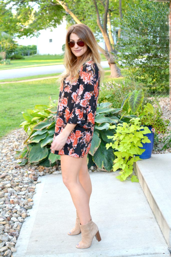 Ashley from LSR in a dark floral dress, sam edelman suede booties, and a choker set