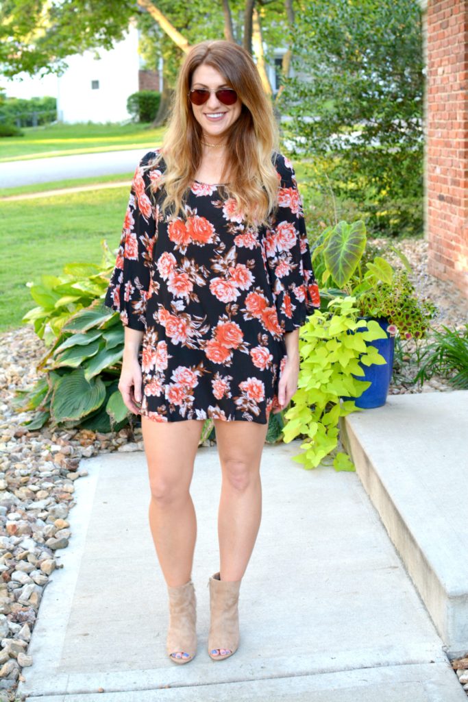 Ashley from LSR in a dark floral dress, sam edelman suede booties, and a choker set