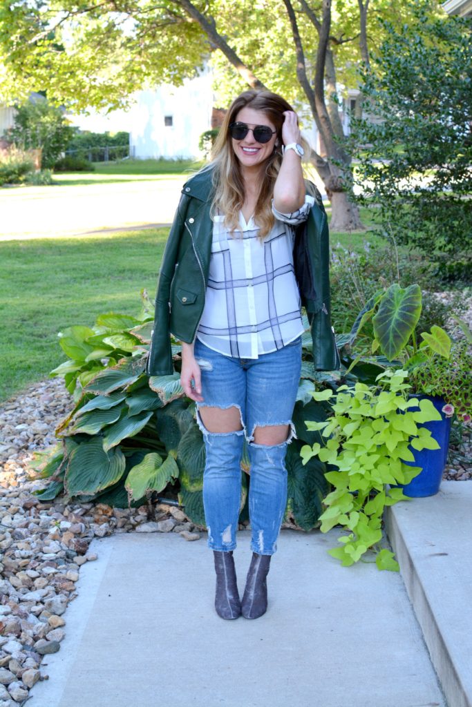 Ashley from LSR in a green leather jacket, destroyed denim, and velvet booties