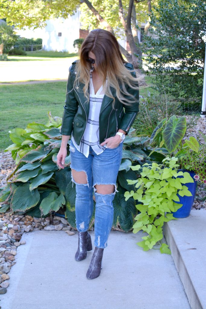 Ashley from LSR in a green leather jacket, destroyed denim, and velvet booties