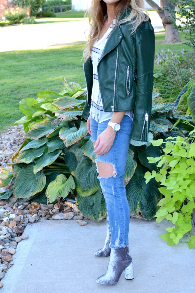Ashley from LSR in a green leather jacket, destroyed denim, and velvet booties