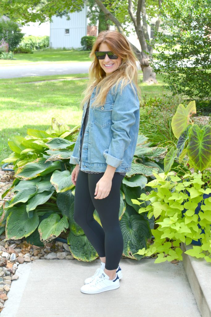 Ashley from LSR in a men's boxy denim jean jacket, striped tee, Carbon38 leggings, and Stan Smith sneakers