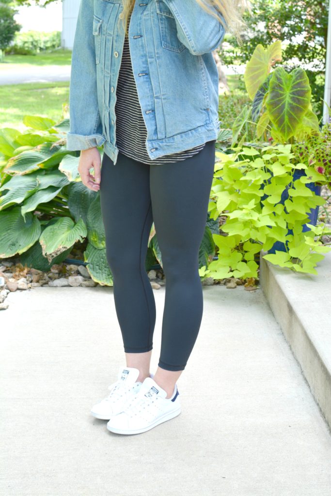 Ashley from LSR in a men's boxy denim jean jacket, striped tee, Carbon38 leggings, and Stan Smith sneakers
