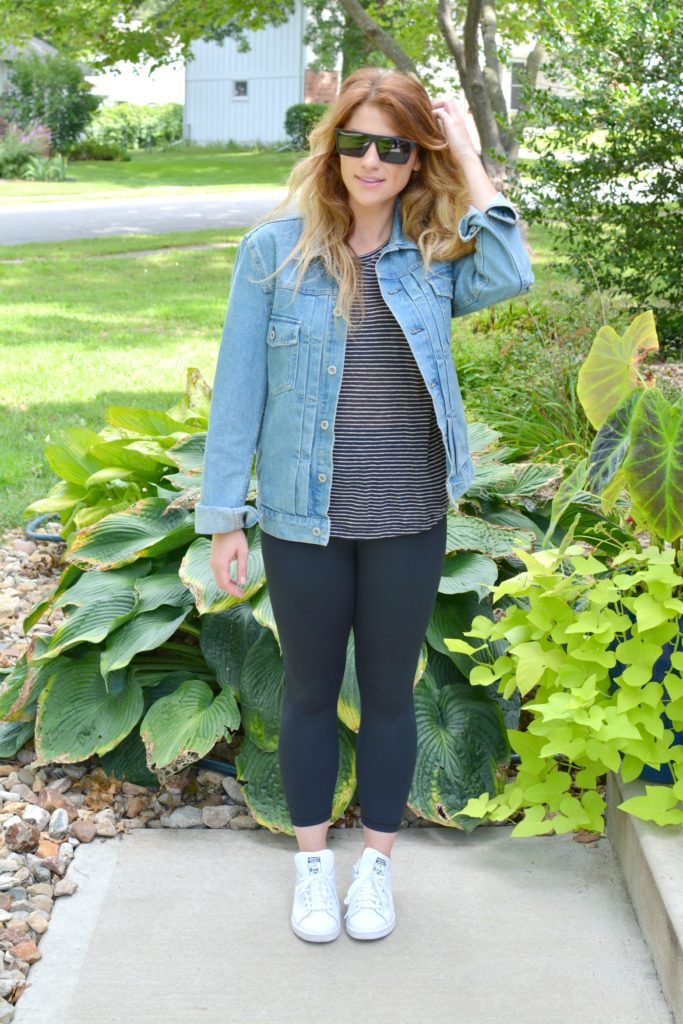 Ashley from LSR in a men's boxy denim jean jacket, striped tee, Carbon38 leggings, and Stan Smith sneakers