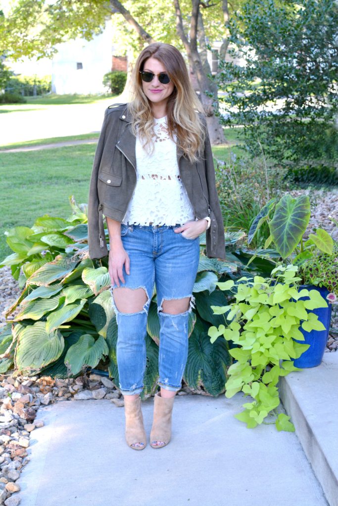 Ashley from LSR in a suede jacket, lace top, destroyed jeans, and Sam Edelman Yarin booties