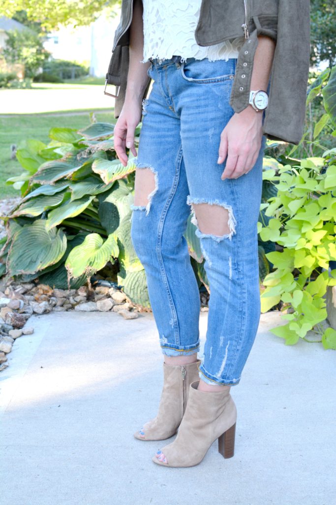 Ashley from LSR in a suede jacket, lace top, destroyed jeans, and Sam Edelman Yarin booties