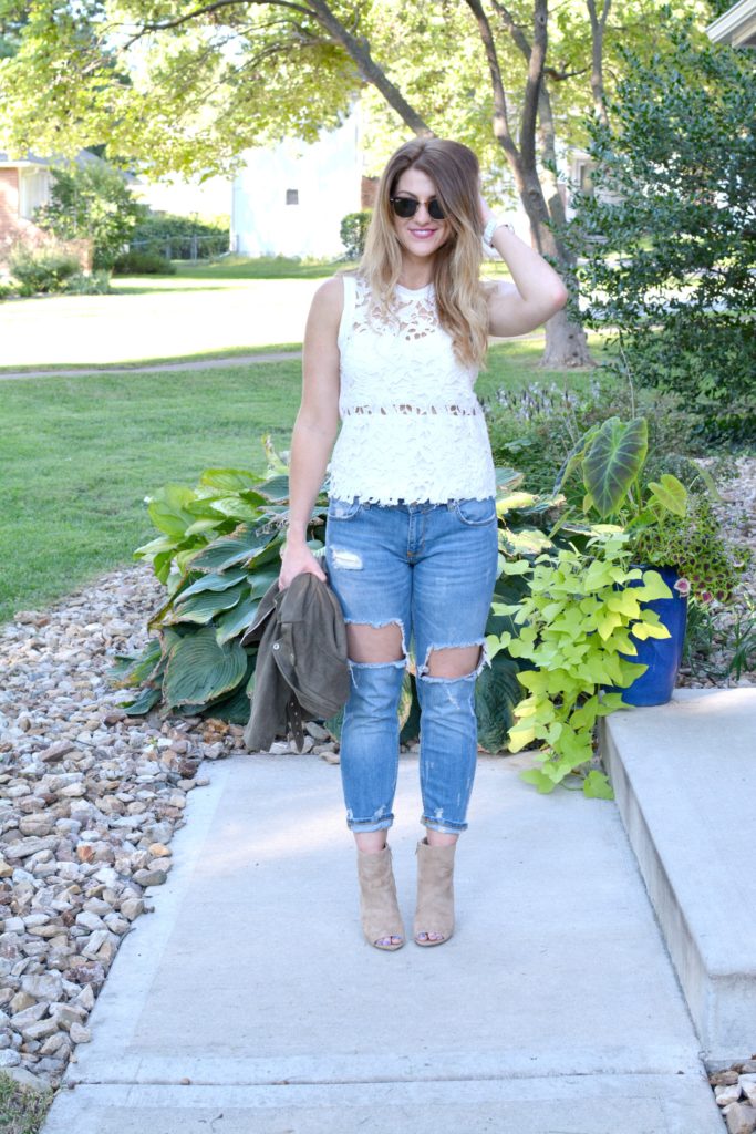 Ashley from LSR in a suede jacket, lace top, destroyed jeans, and Sam Edelman Yarin booties