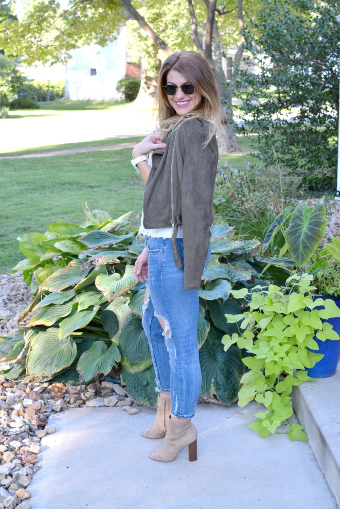 Ashley from LSR in a suede jacket, lace top, destroyed jeans, and Sam Edelman Yarin booties