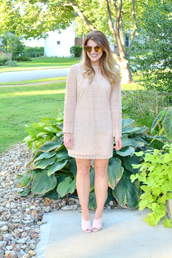 Ashley from LSR in a nude lace dress and blush suede mules