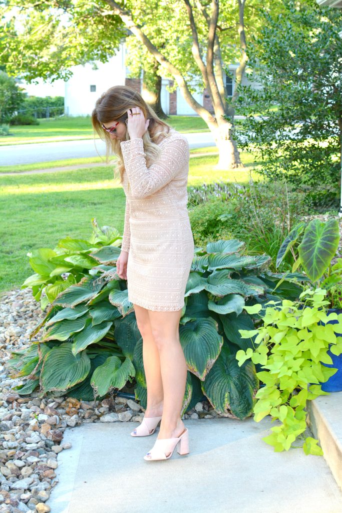 Ashley from LSR in a nude lace dress and blush suede mules