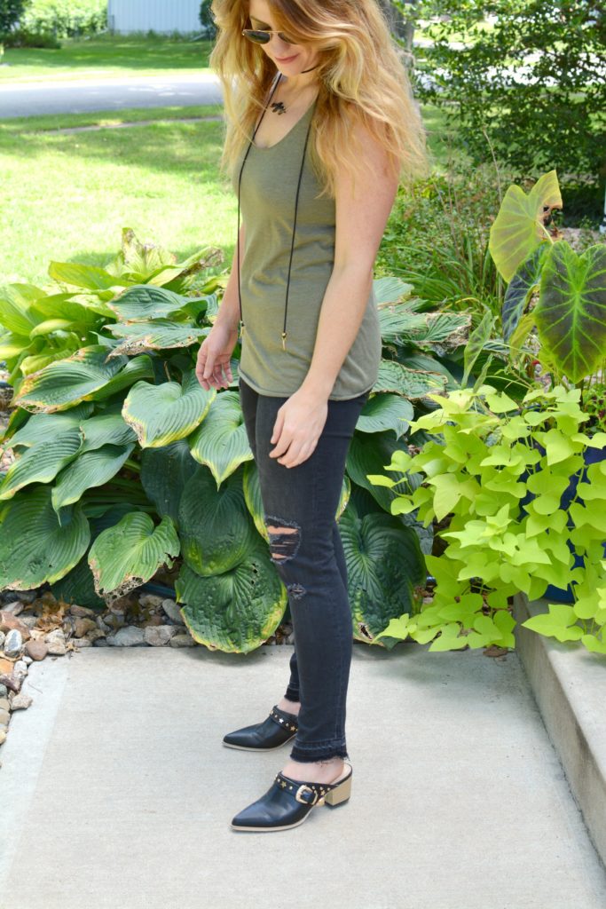 Ashley from LSR in black shredded jeans, leather mules, and a Vanessa Mooney choker