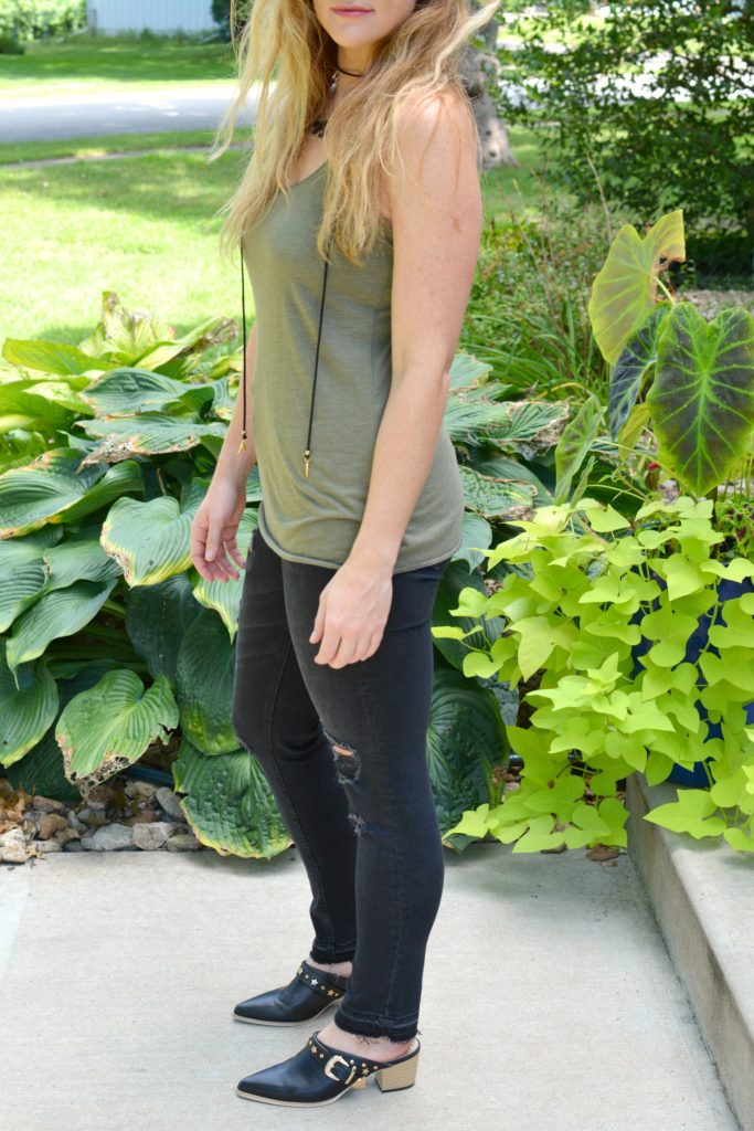 Ashley from LSR in black shredded jeans, leather mules, and a Vanessa Mooney choker