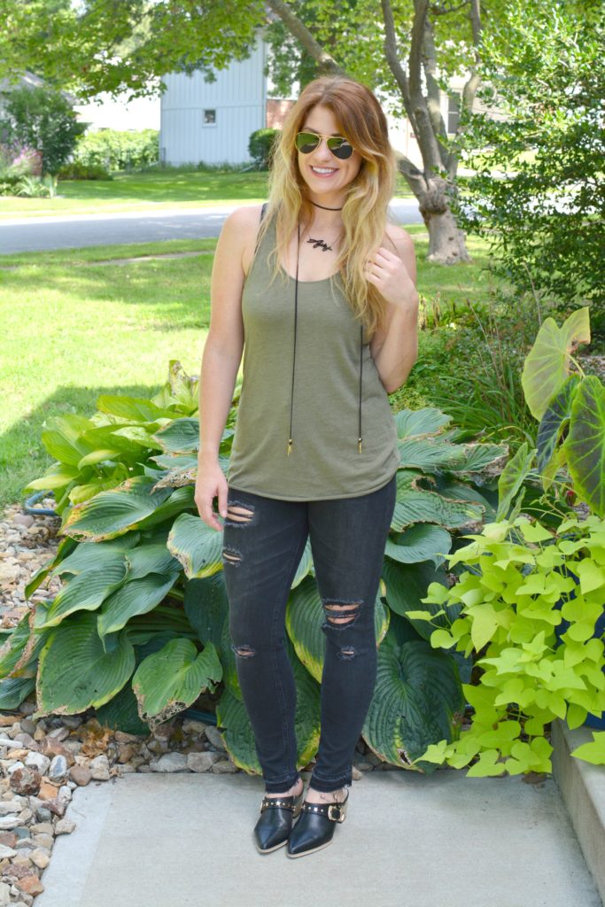 Ashley from LSR in black shredded jeans, leather mules, and a Vanessa Mooney choker