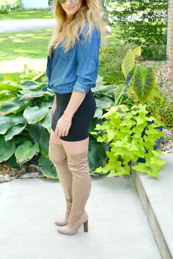 Ashley from LSR in a black t-shirt dress, nude suede thigh high boots, and a chambray shirt