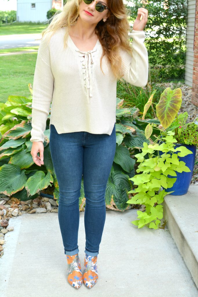 Ashley from LSR in a lace-up sweater and statement ankle boots