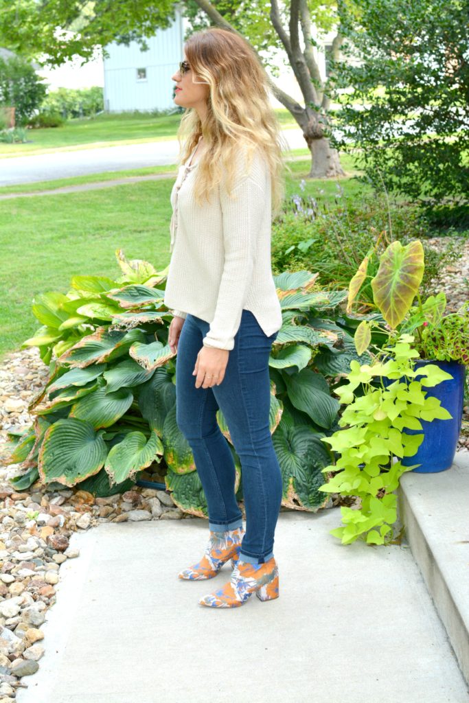 Ashley from LSR in a lace-up sweater and statement ankle boots