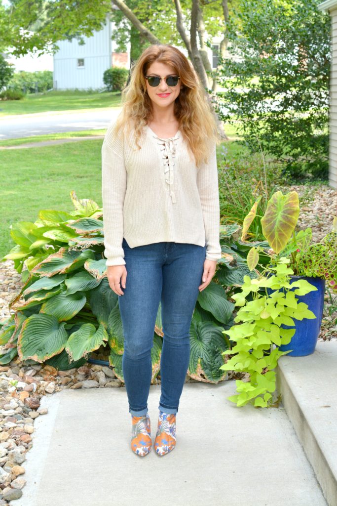 Ashley from LSR in a lace-up sweater and statement ankle boots